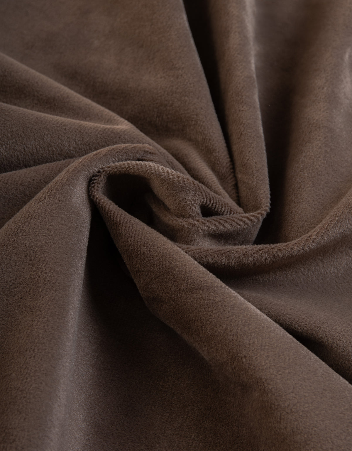Close-up of curtain fabric in brown velvet