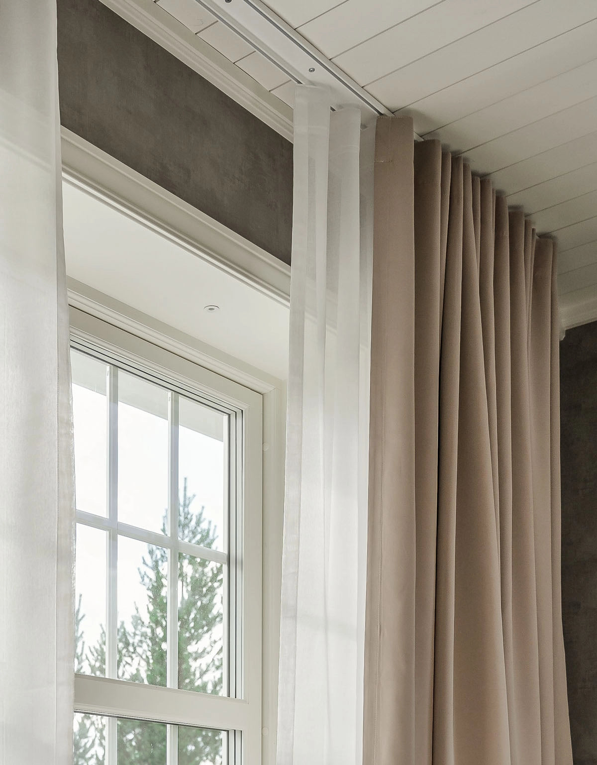 Two-track curtain track with double curtains