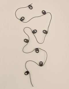 Black curtain track gliders on a cord
