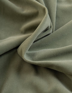 Green curtain fabric in velvet